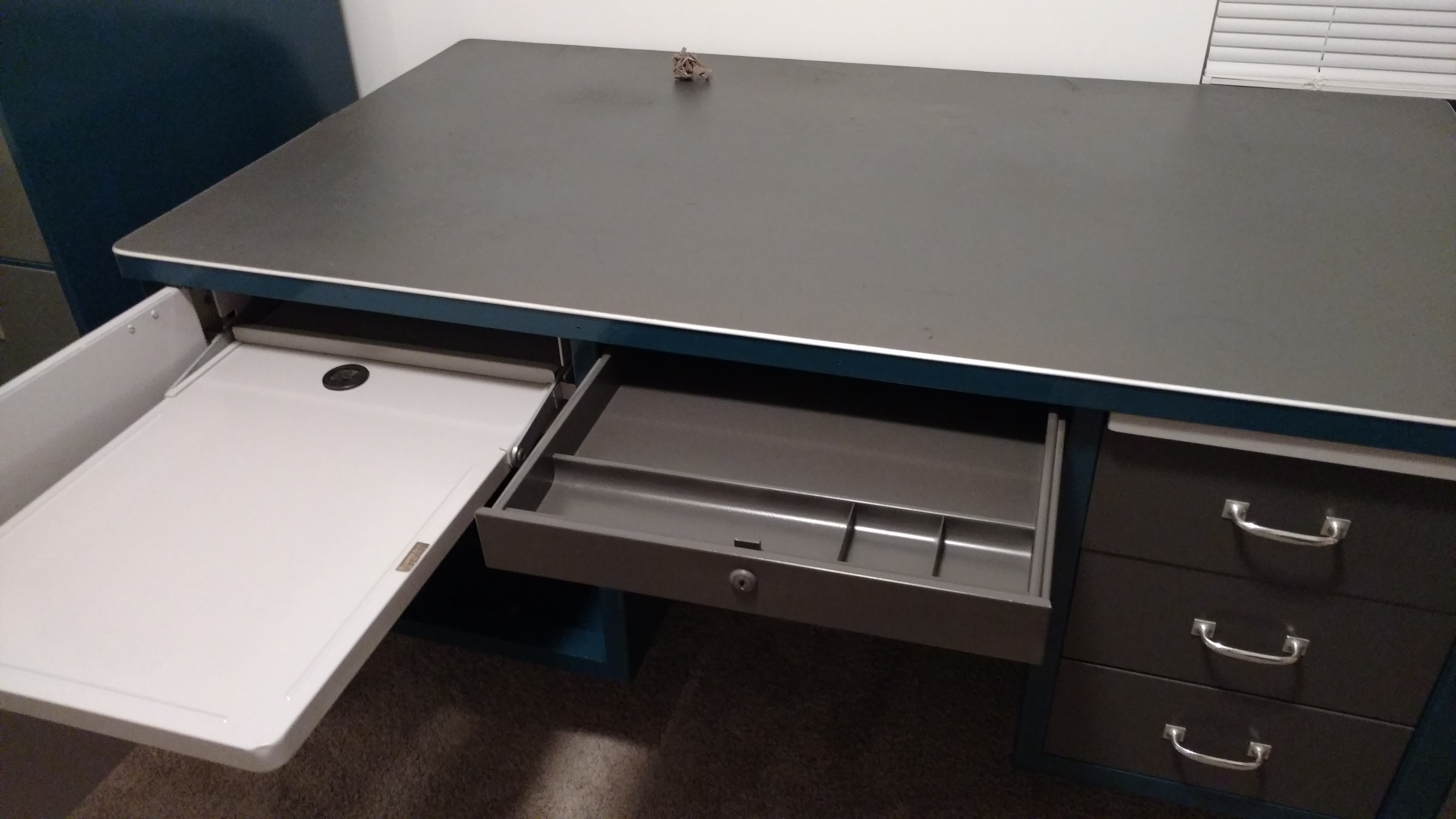 Open left cabinet and typewriter shelf