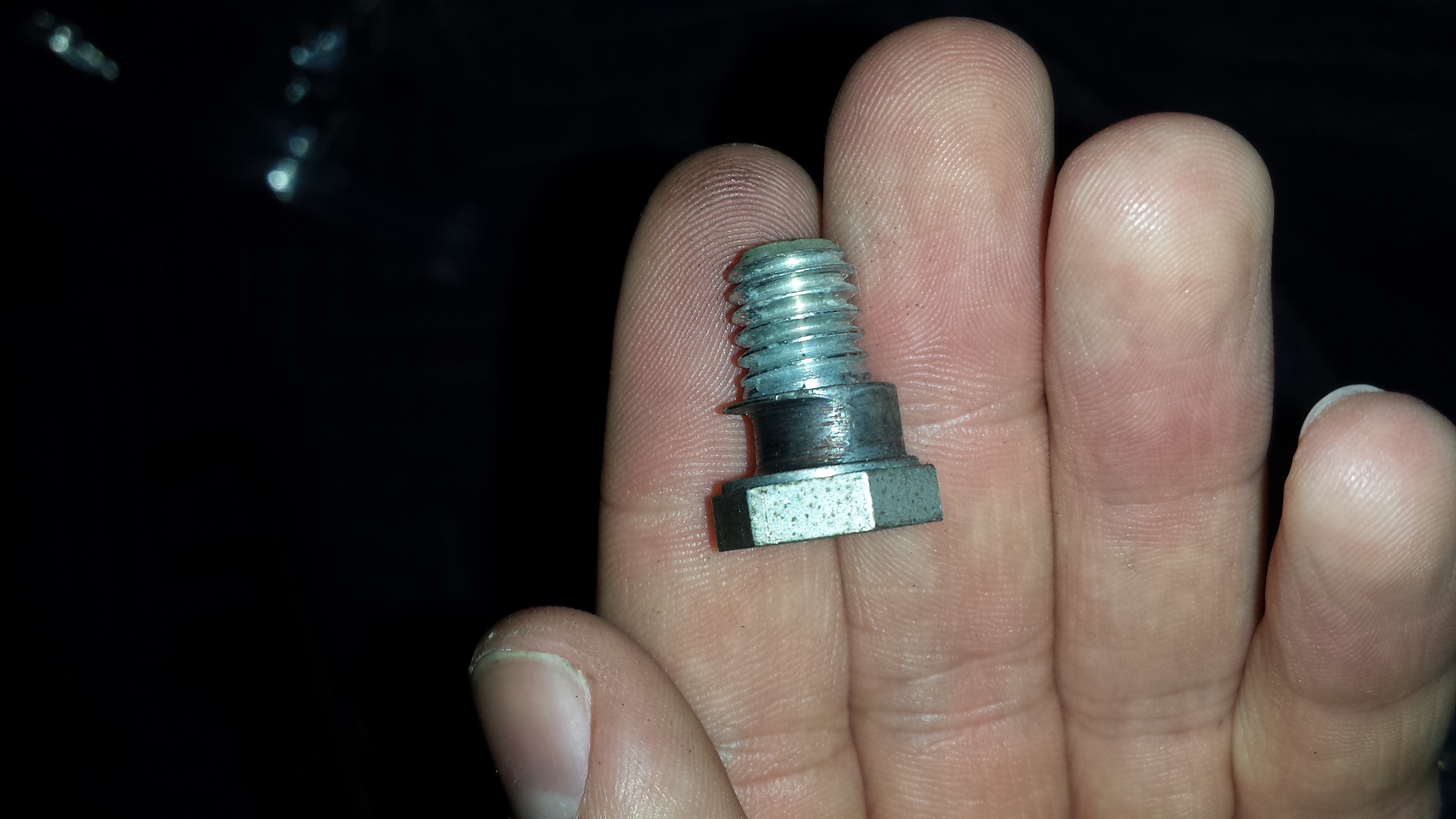 Worn mounting bolt closeup